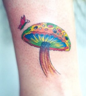 Colourful mushroom and butterfly tattoo