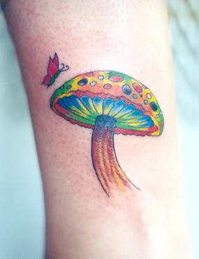 Colourful mushroom and butterfly tattoo