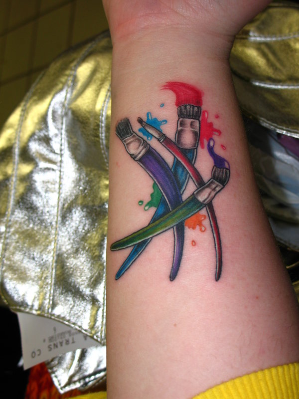 Colourful paint brushes tattoo