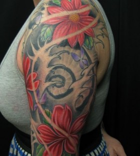 Colourful sleeve tattoo by Jon Mesa