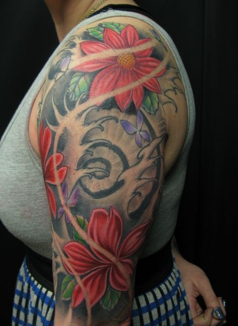Colourful sleeve tattoo by Jon Mesa
