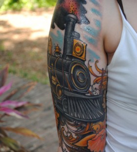 Colourful train arm tattoo