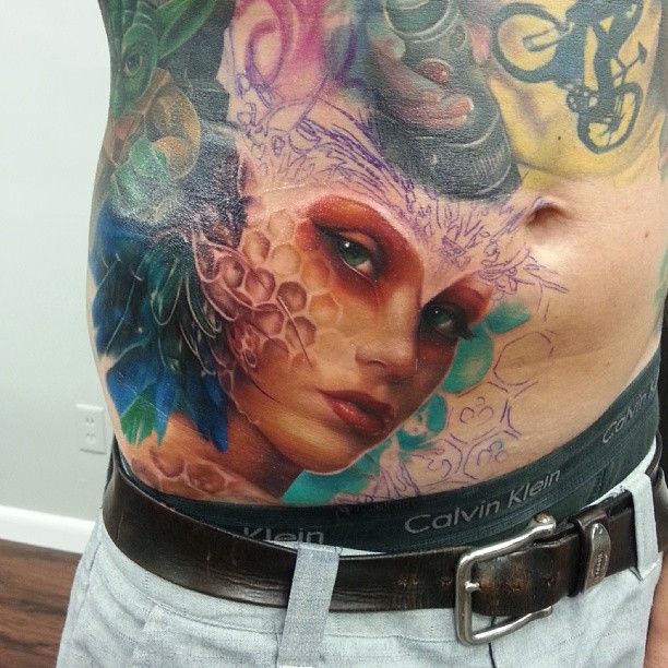 Colourful woman tattoo by Kyle Cotterman