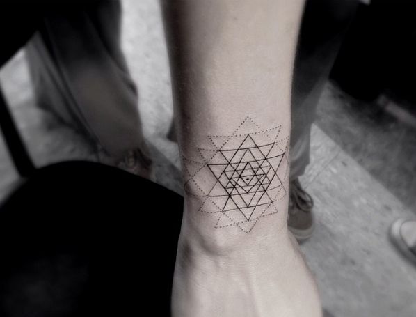 Cool black triangle tattoo