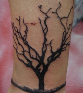 Cool dead tree tattoo