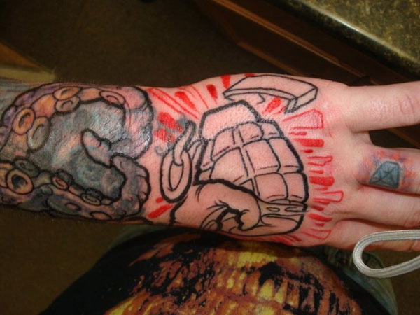 Cool grenade hand tattoo