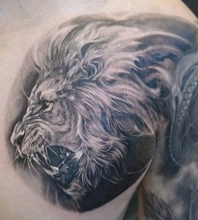 Cool lion tattoo by Elvin Yong