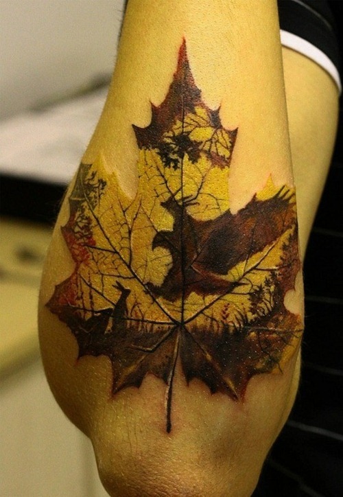 Cool maple leaf arm tattoo