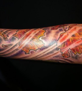 Cool maple leaves arm tattoo