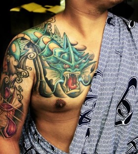 Cool pokemon arm and chest tattoo