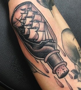 Cool ship in a bottle tattoo