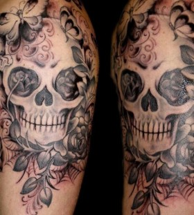 Cool skull and flowers tattoo