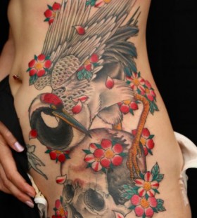 Crane and skull tattoo