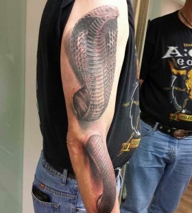 Creative cobra arm tattoo