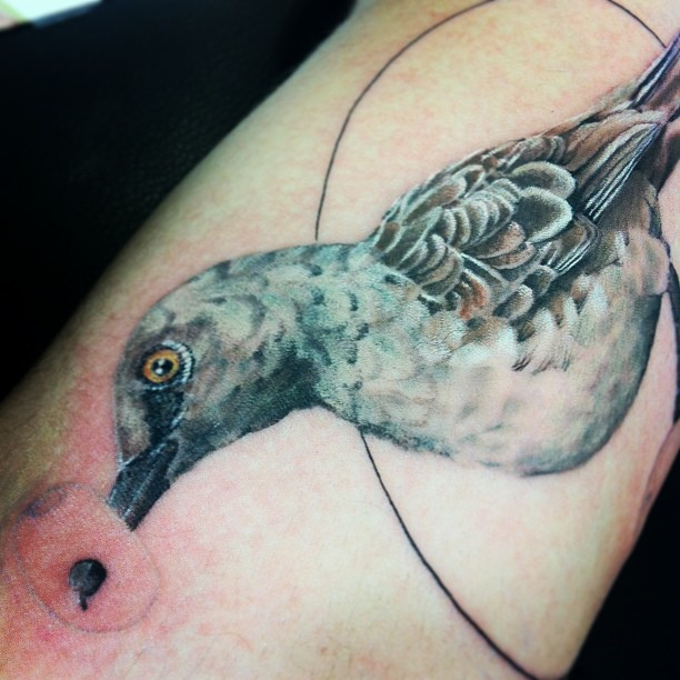 Creative mockingbird tattoo