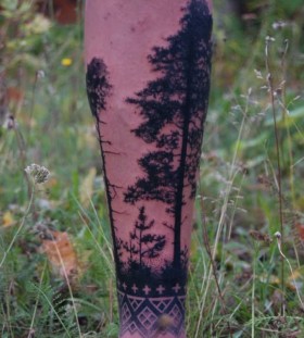 Creative pine tree arm tattoo