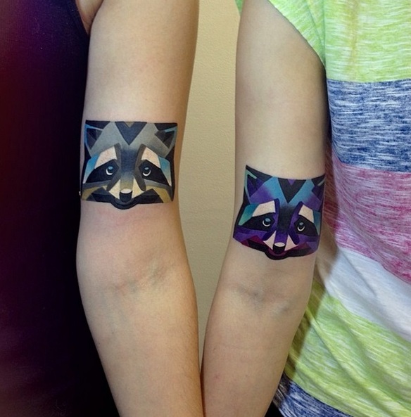 Creative raccoon arm tattoos