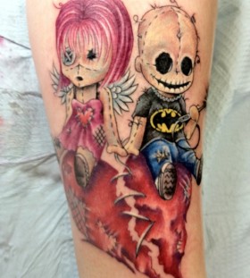 Creepy doll and broken heart tattoo