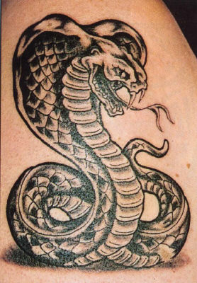 Creepy king cobra tattoo