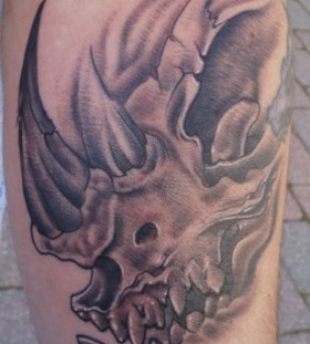 Creepy rhino skull tattoo