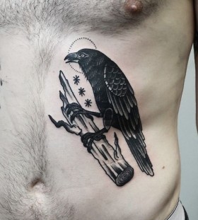Crow on a branch tattoo by Philip Yarnell