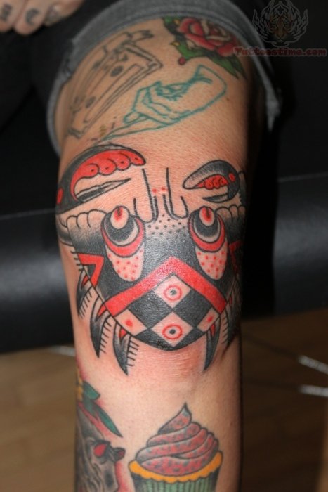 Custom black and red crab tattoo
