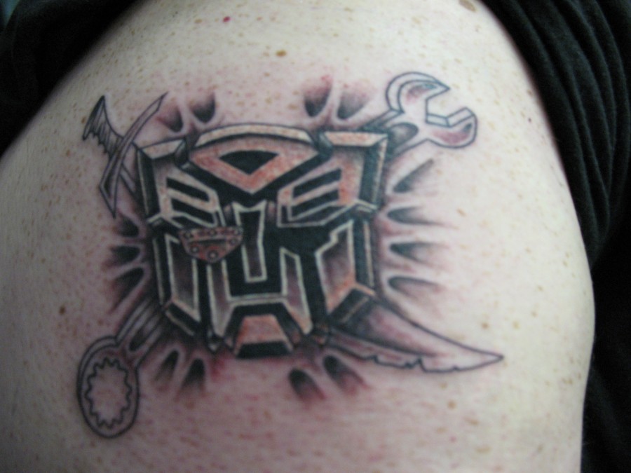 Custom transformers logo tattoo