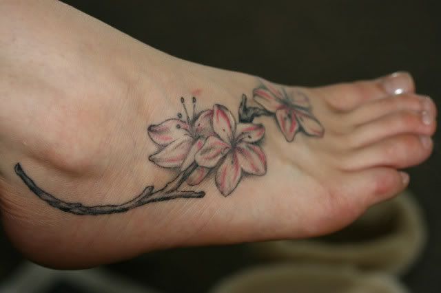 Cute apple blossom foot tattoo