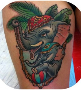 Cute elephants tattoo by W. T. Norbert