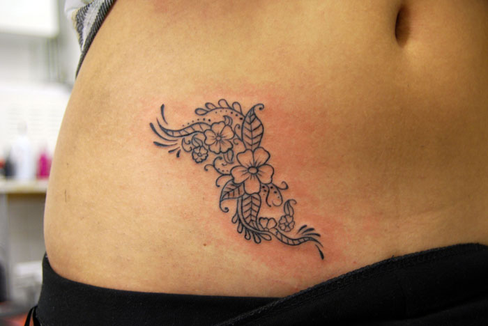 Cute flowers stomach tattoo