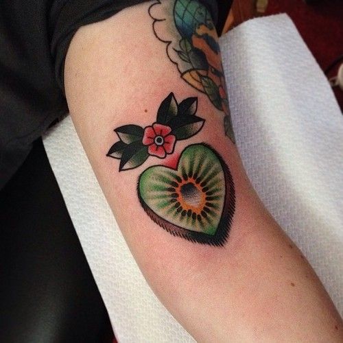 Cute green fruit tattoo