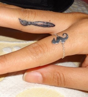 Cute paint brush finger tattoo