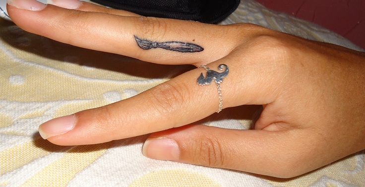 Cute paint brush finger tattoo