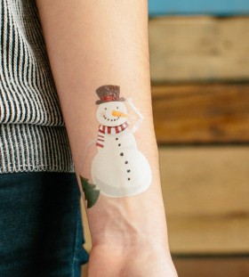 Cute snowman arm tattoo