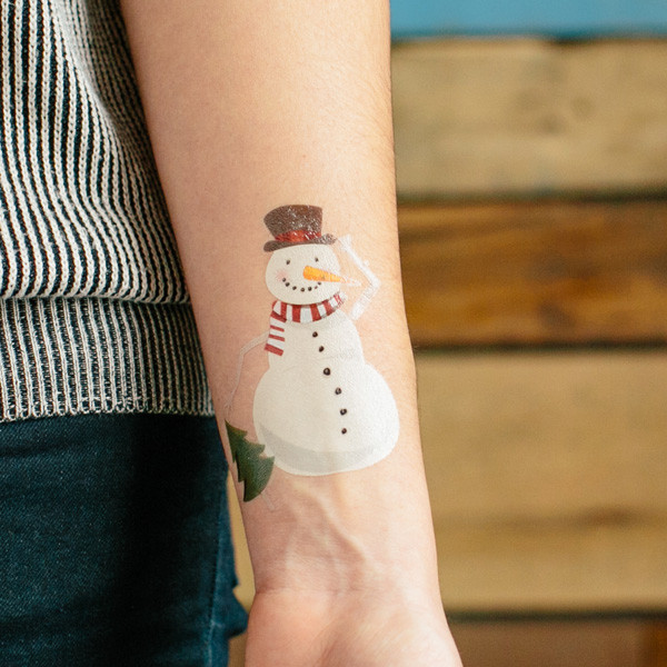 Cute snowman arm tattoo