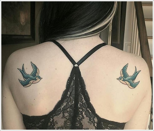 Cute swallow back tattoo