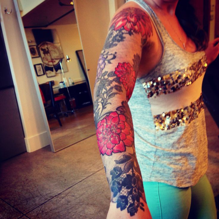 Dahlia flowers arm tattoo