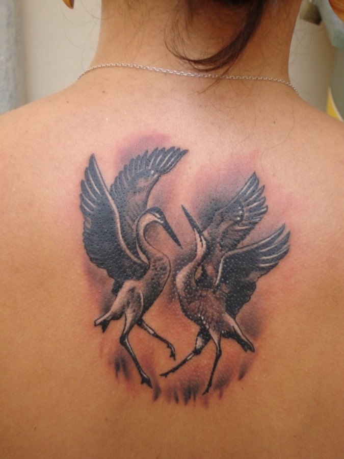Dancing cranes back tattoo