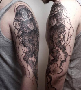Dark jellyfish arm tattoo