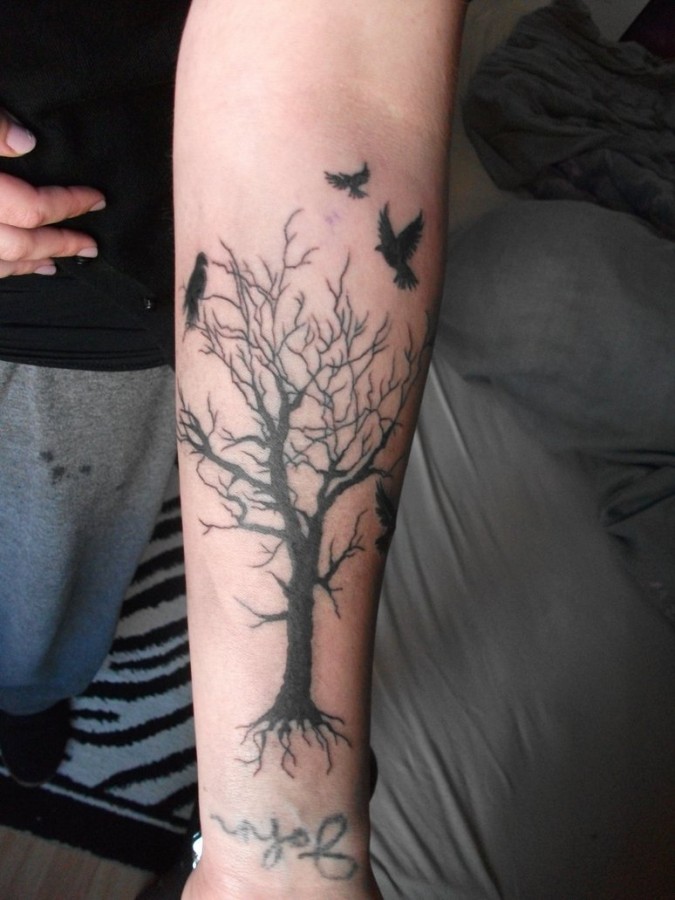 Dead tree and birds tattoo