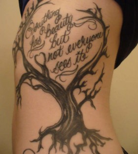 Dead tree and quote tattoo