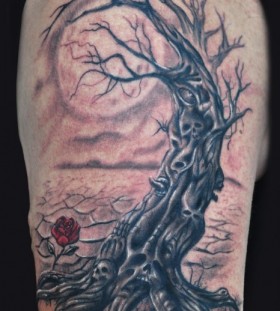 Dead tree and rose tattoo