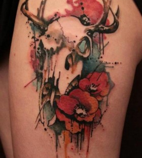 Deer skull and flower tattoo