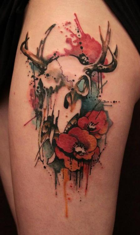 Deer skull and flower tattoo