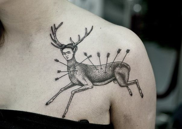 Deer with a womans face tattoo