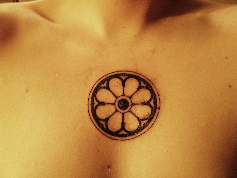 Dharma wheel chest tattoo