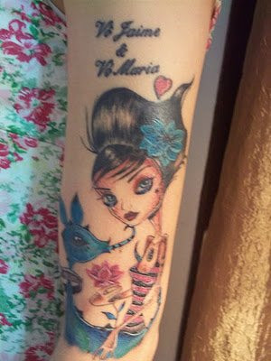 Doll and animal tattoo