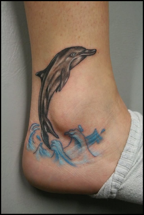 Dolphin and waves akle tattoo