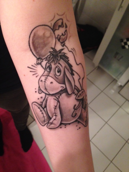 Donkey with a balloon tattoo