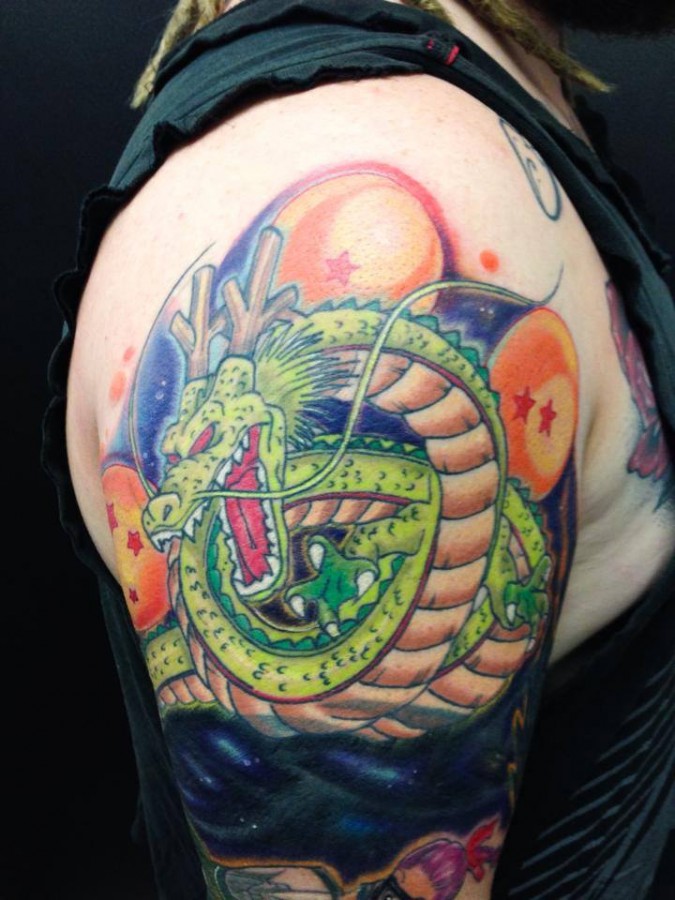 Dragon ball theme arm tattoo